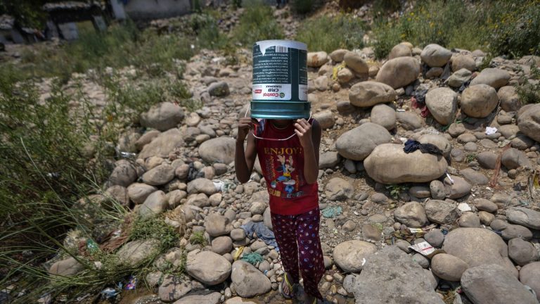 A scorching heat wave kills 14 in India ahead of a final round of election voting on Saturday