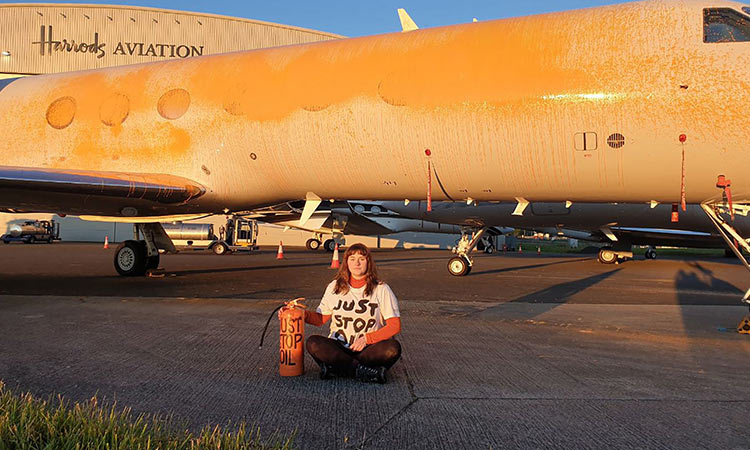 Climate activists arrested for spray-painting private jets orange at London Climate activists arrested for spray-painting private jets orange at London airport