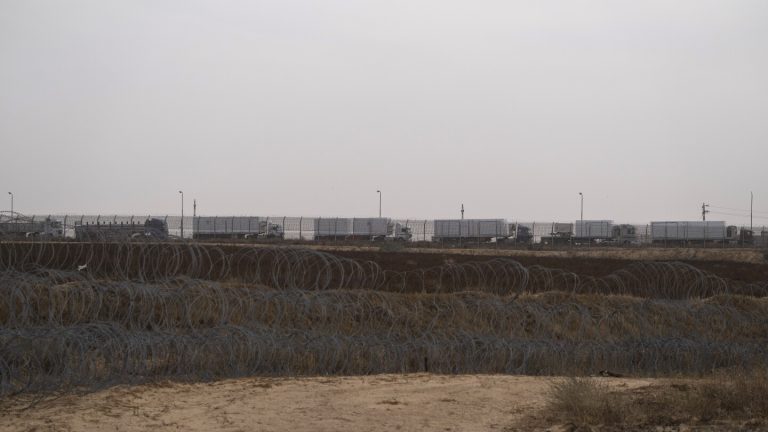 Israel’s pledge to guard an aid route into Gaza falls flat as lawlessness blocks distribution