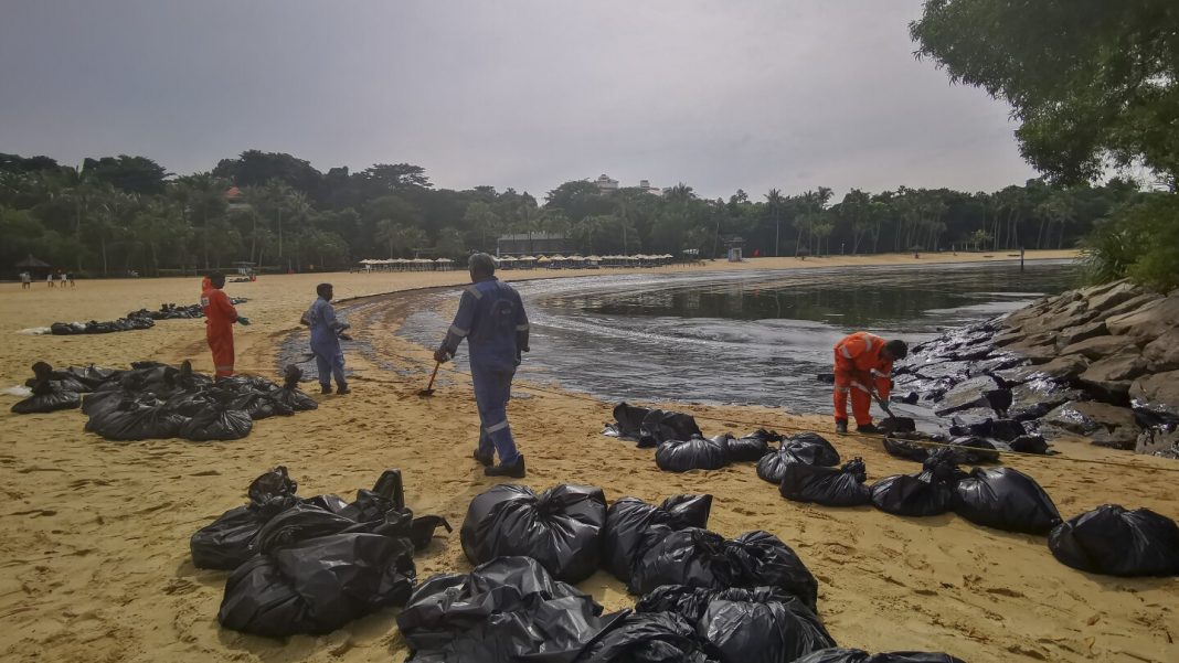 Singapore rushes to clean-up oil slick after boat hits stationary Singapore rushes to clean-up oil slick after boat hits stationary fuel supply ship