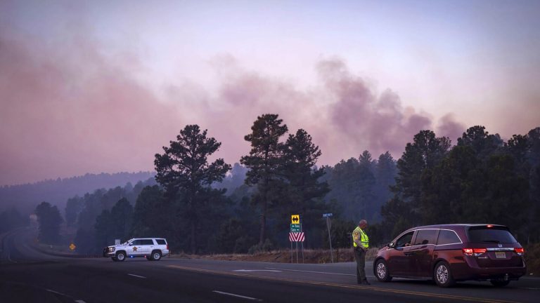 Thousands flee New Mexico wildfires that have damaged 500 structures; governor declares emergency