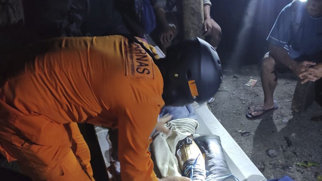 Rescuers search for dozens buried by an Indonesian landslide that Rescuers search for dozens buried by an Indonesian landslide that killed at least 23 people