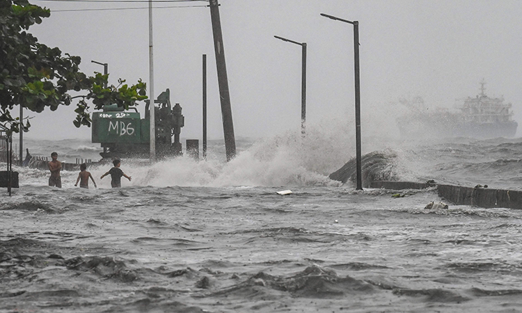 Storm sets off floods and landslides in Philippines, leaving at Storm sets off floods and landslides in Philippines, leaving at least 14 dead
