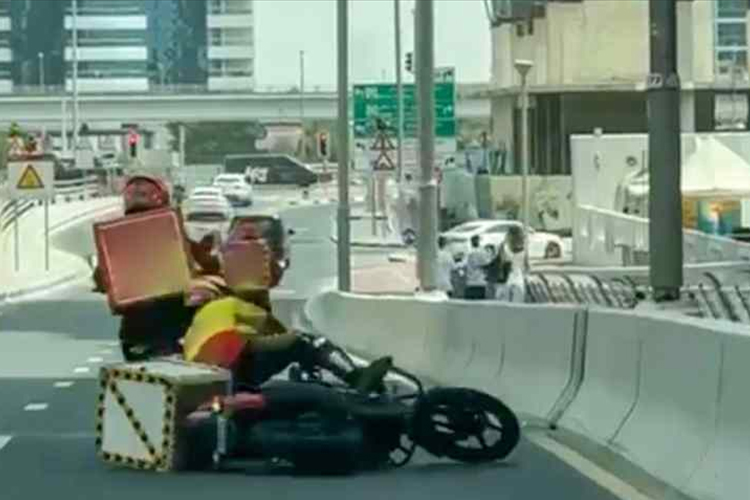 Dubai Police arrest delivery rider for deliberately knocking down another Dubai Police arrest delivery rider for deliberately knocking down another biker