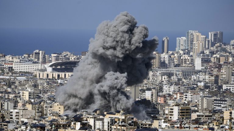 Israeli strikes set off explosions in Beirut suburbs and kill 14 Palestinians in Gaza, medics say